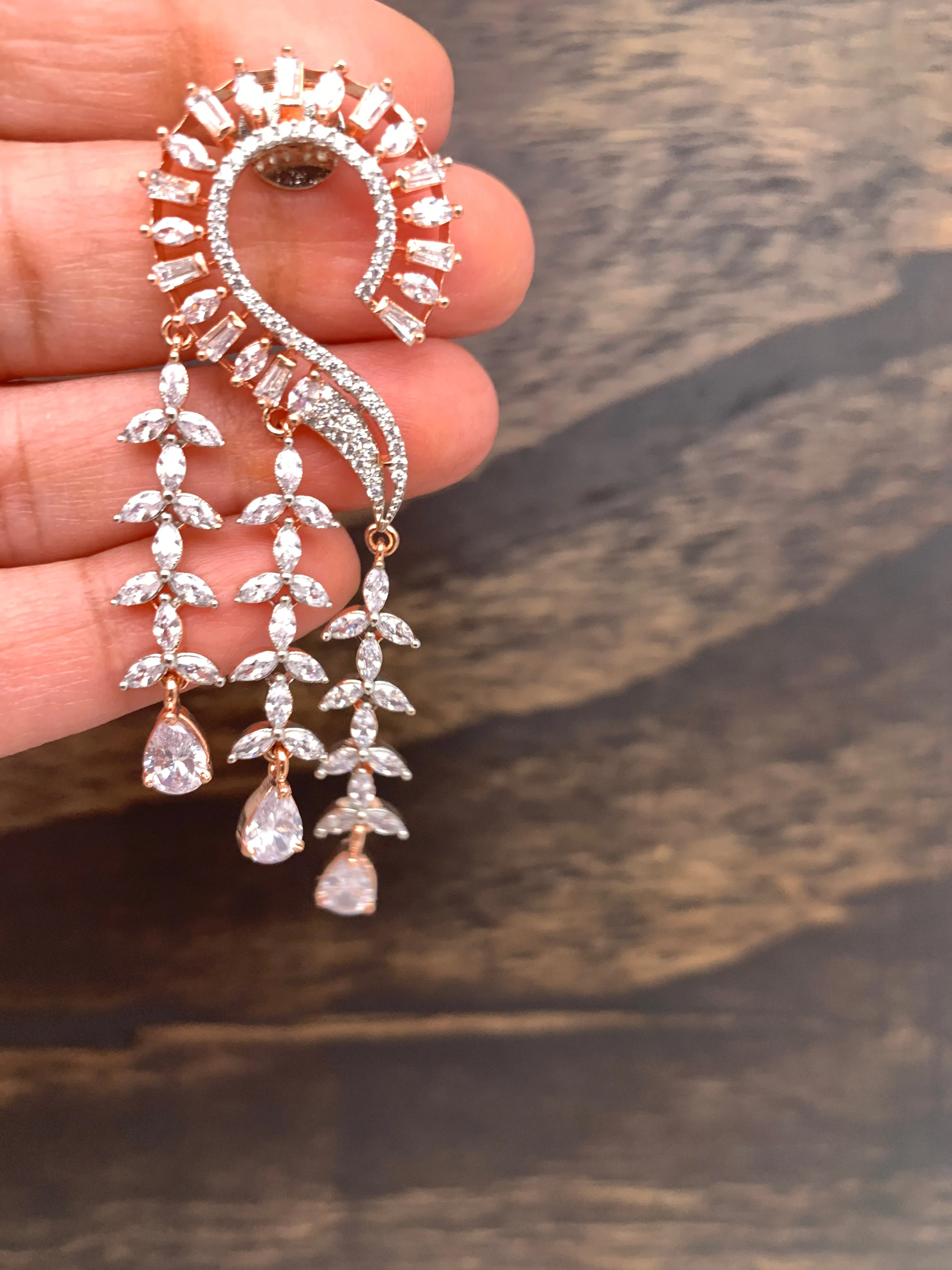 AD Earrings with Clear Stone Danglers in Rose Gold Polish
