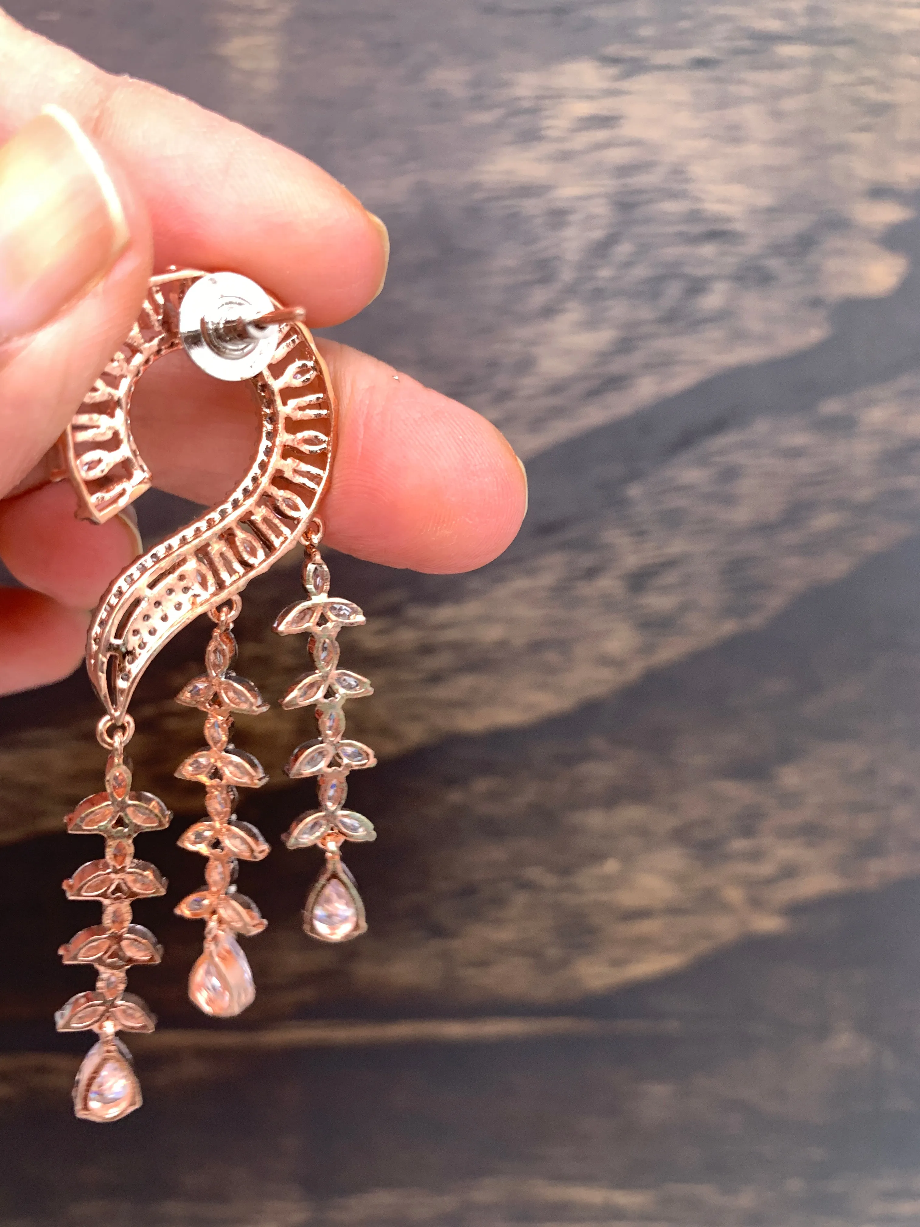 AD Earrings with Clear Stone Danglers in Rose Gold Polish
